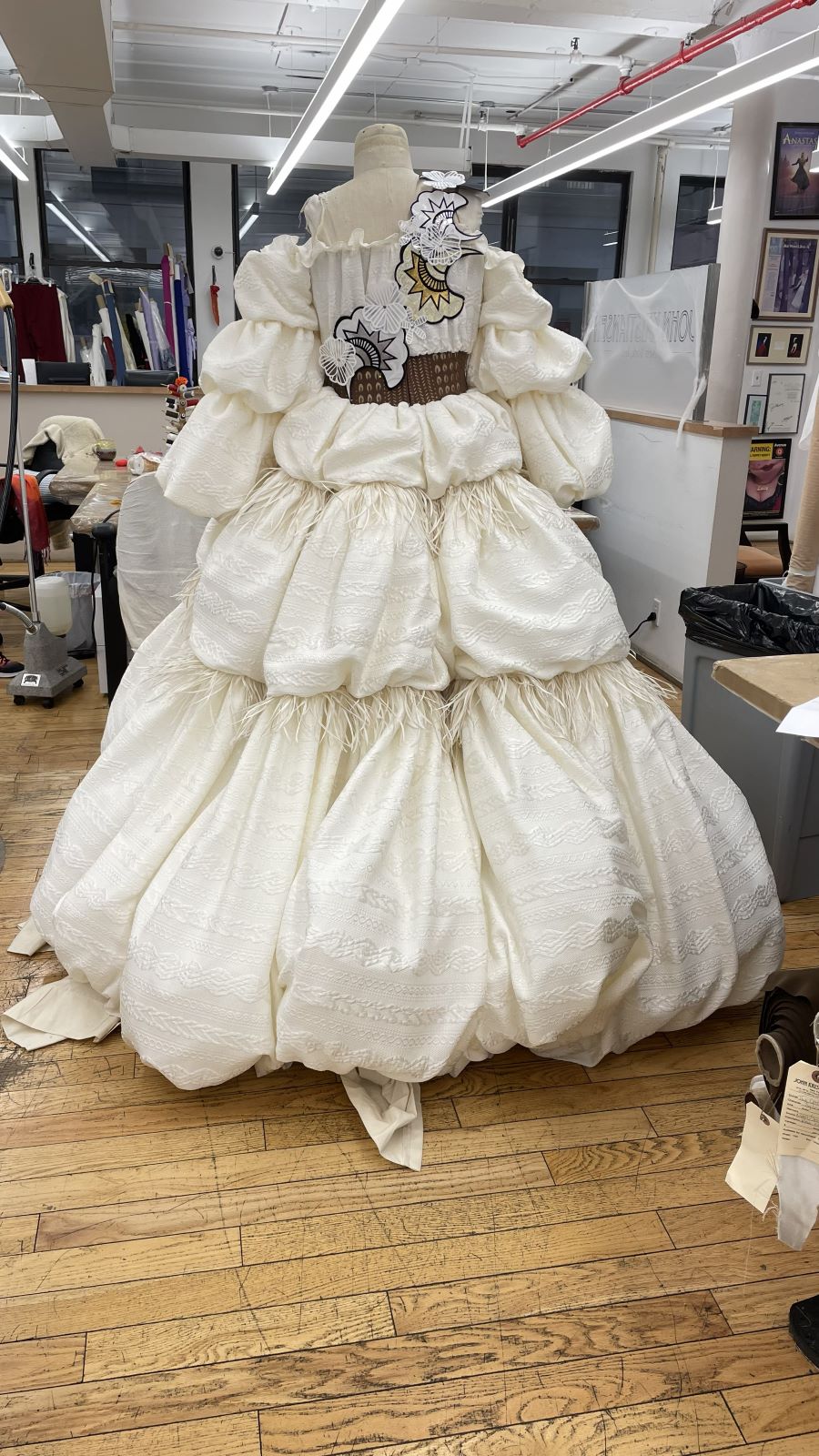 Ivory ball gown with hand-gathered skirt on the form