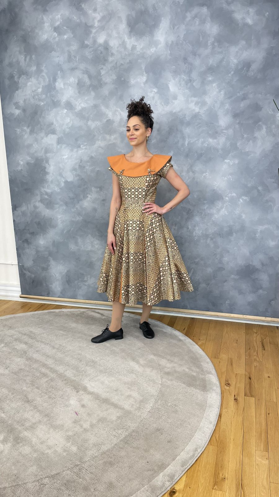 Off-shoulder tea-length occasion dress on the model