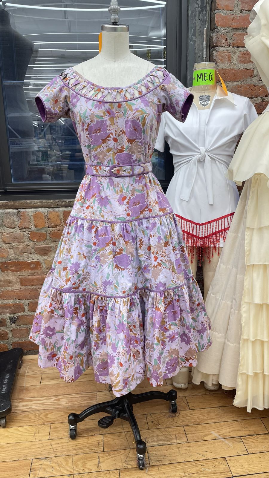 Printed occasion dress with gathered tiers on the form