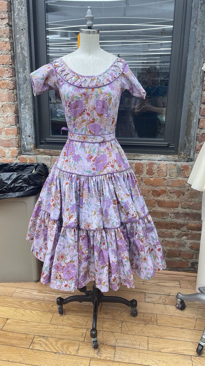 Printed occasion dress with a portrait neckline on the form